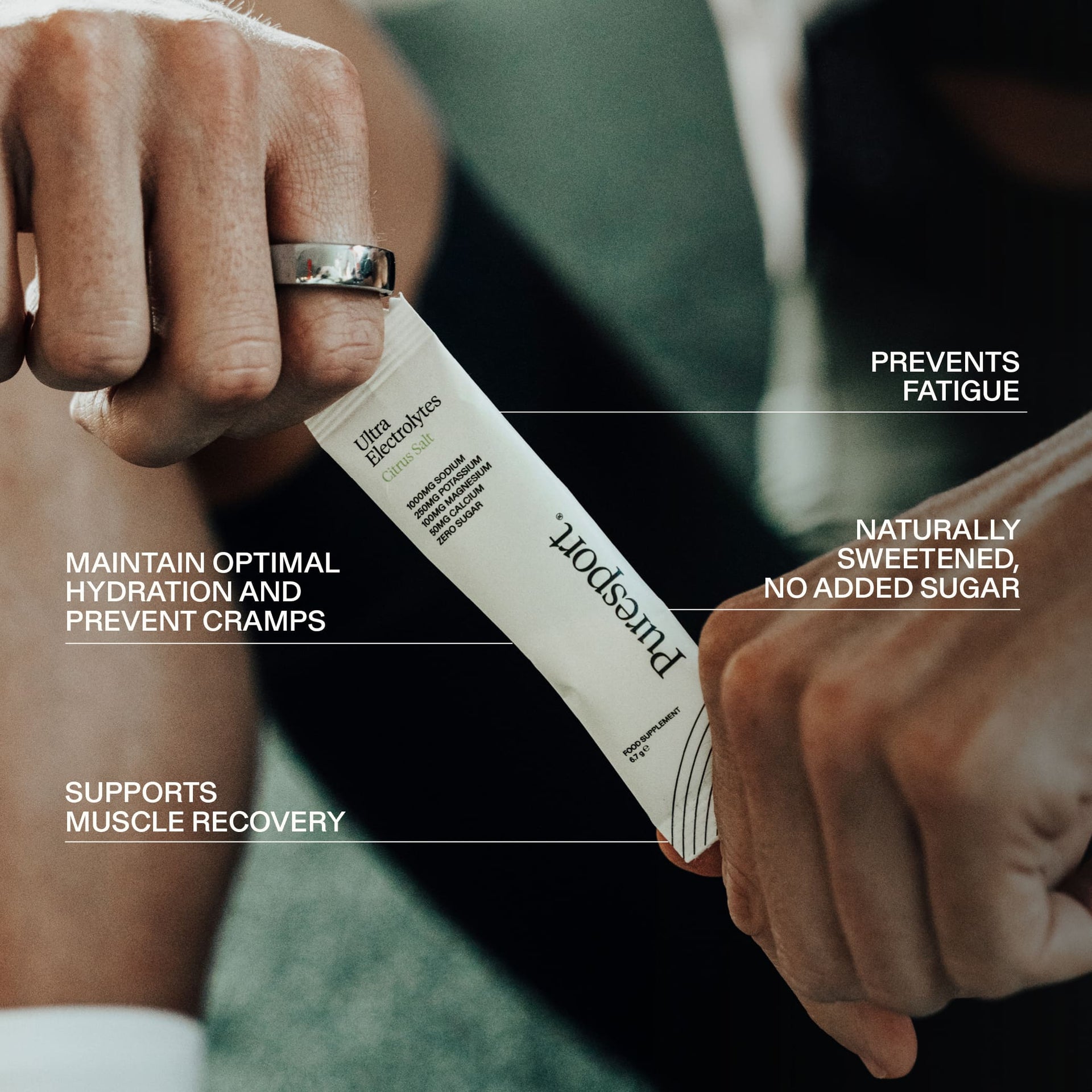 Runner holding a sachet of Puresport electrolyte powder with electrolytes benefits with overlay text.