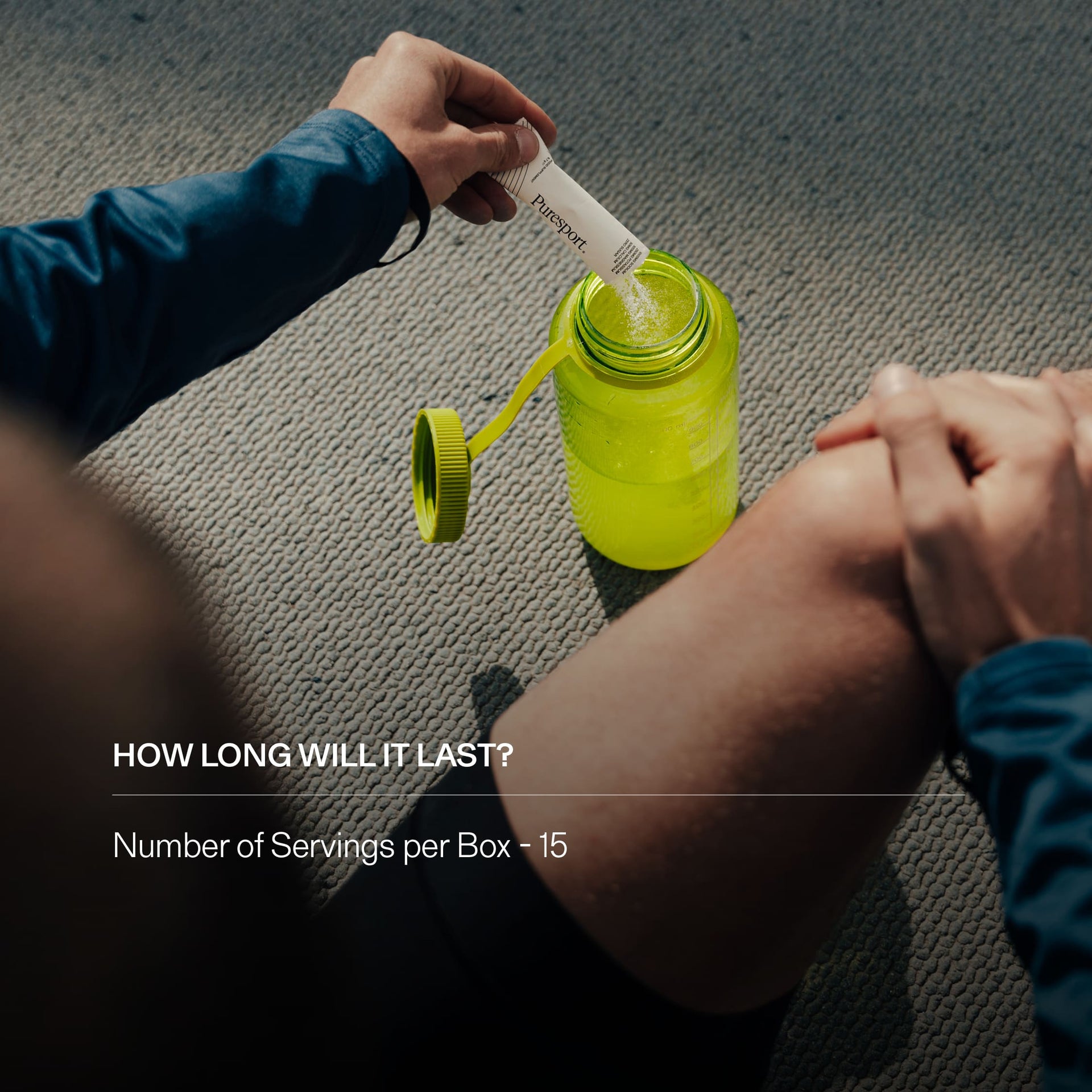 Person opening a sports water bottle and pouring electrolytes into it.