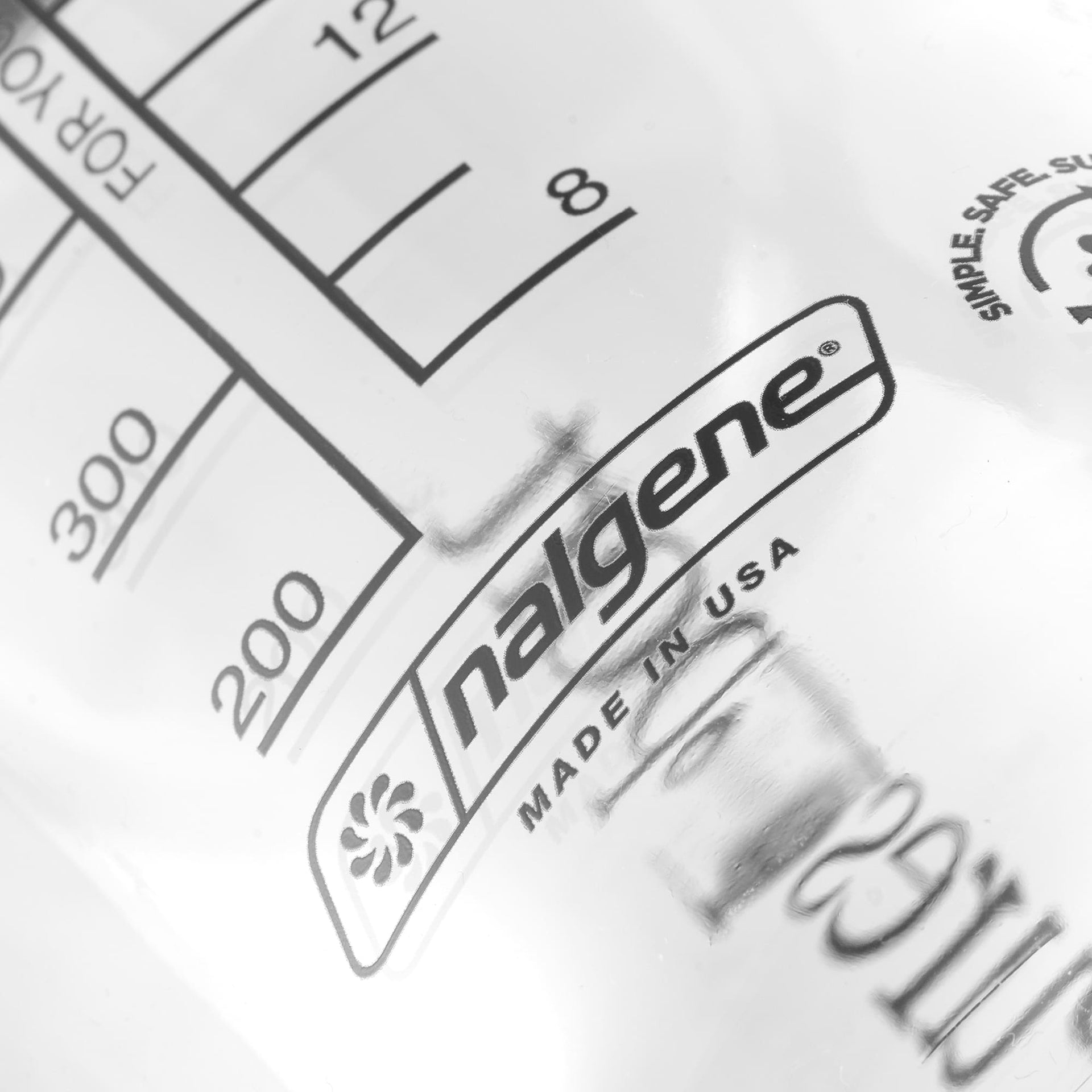 Nalgene water bottle label with measurement markings and 'Made in USA' text.