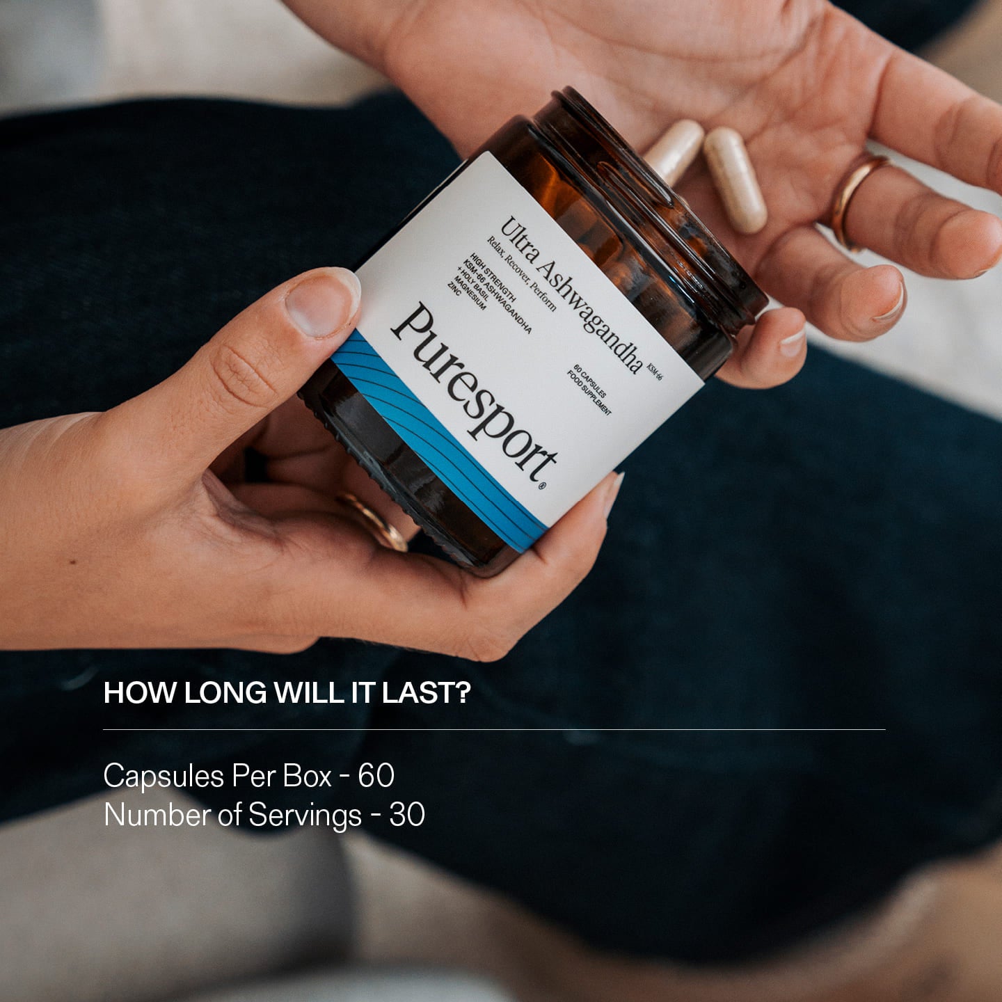 Person holding a jar of Puresport supplements Ashwagandha with text about duration and contents.