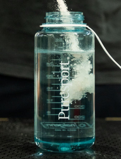 Puresport naglene with electrolytes getting poured into a seaform bottle