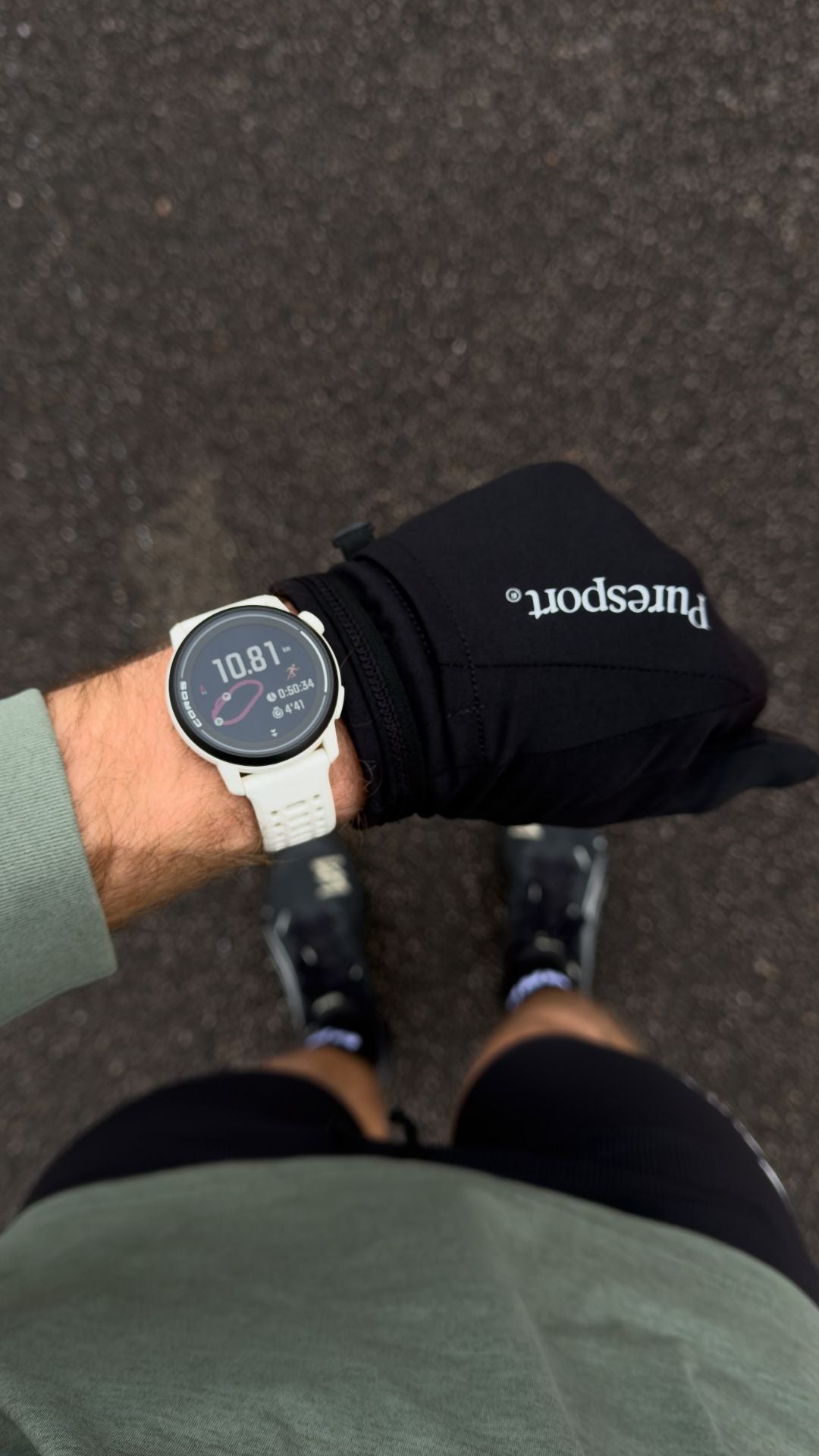 Runner wearing a coros pace 2 with a blurred background