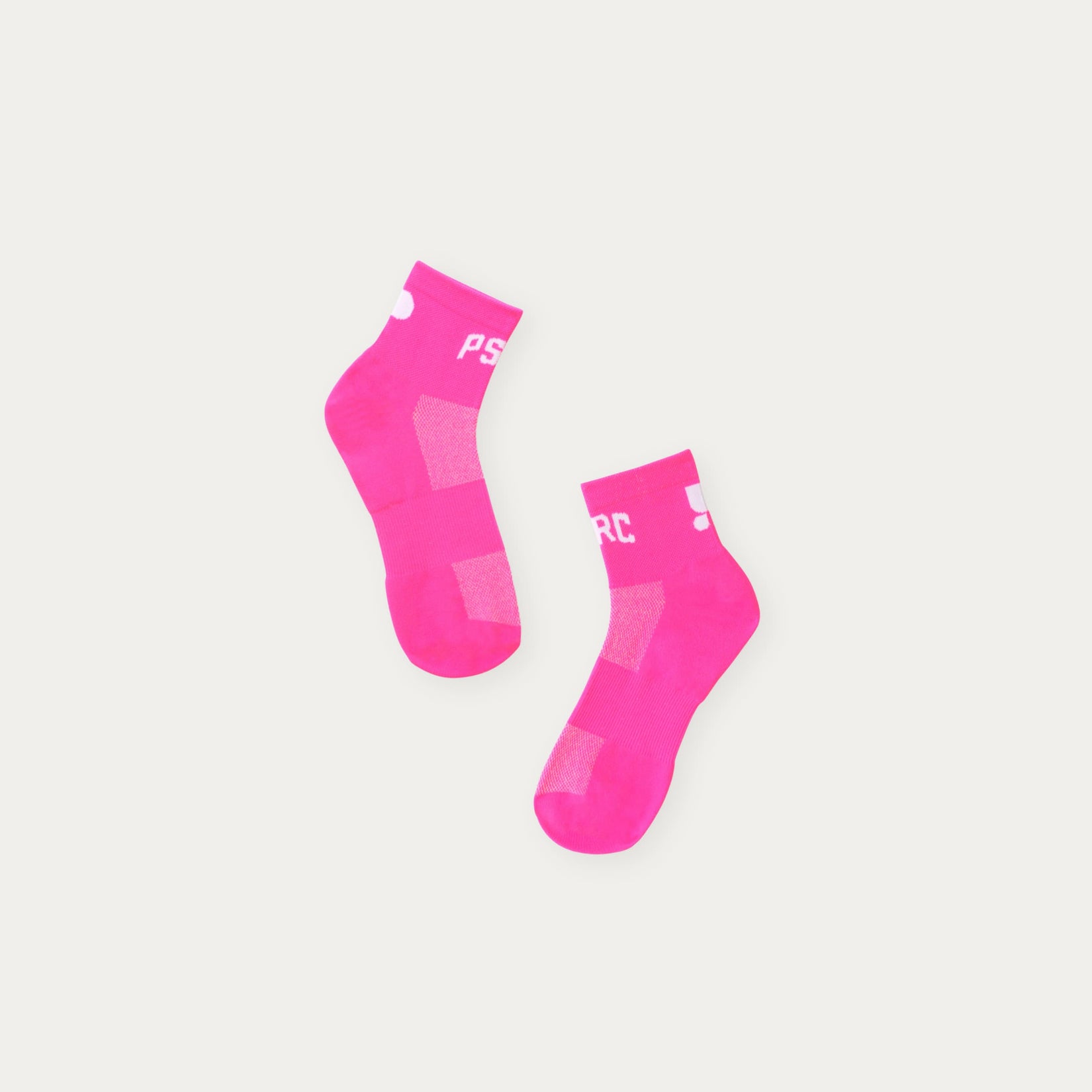 Two pink ankle socks with Puresport on a light grey background