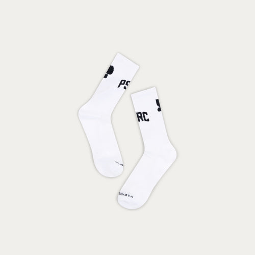 White socks with black puresport branding on a grey background