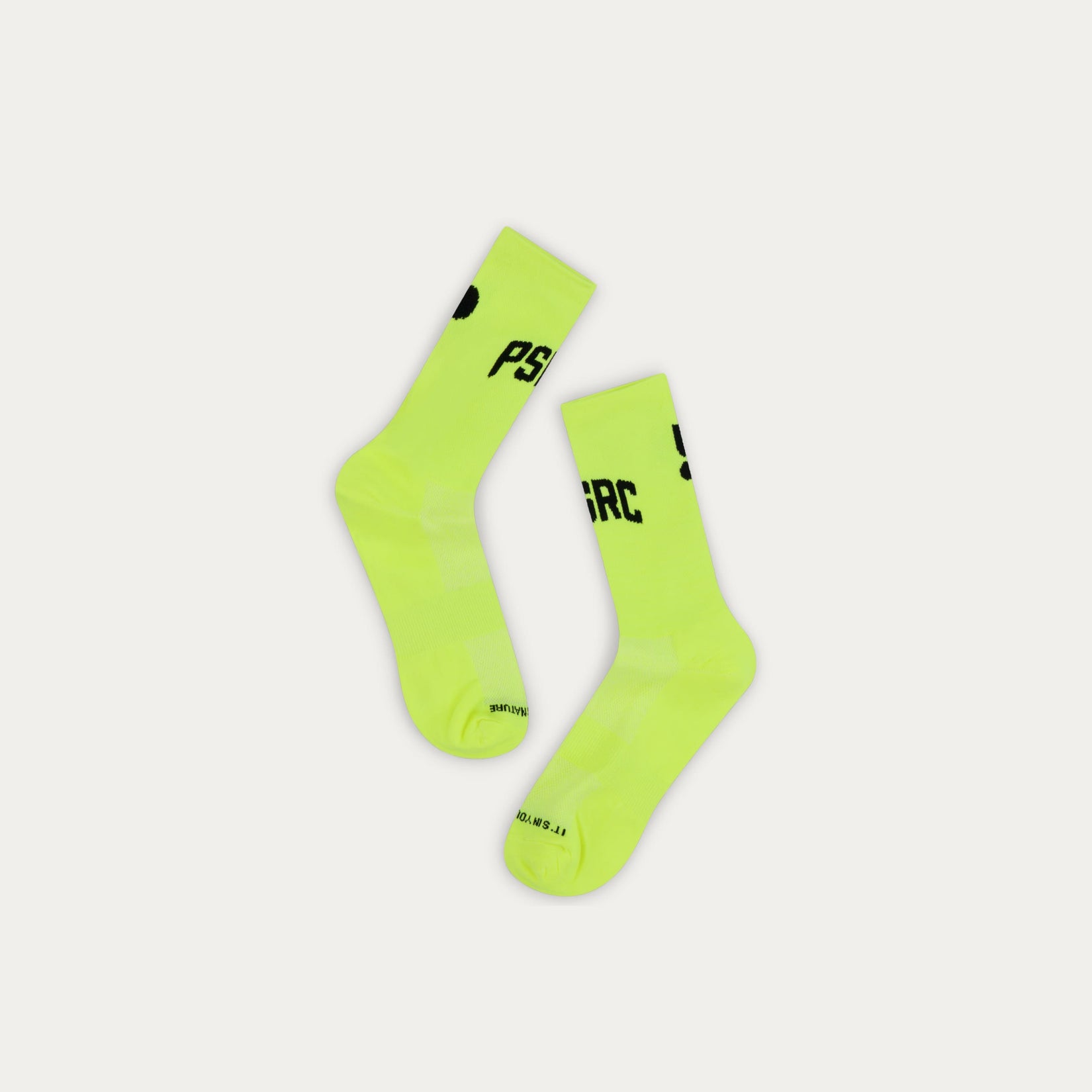 Pair of neon green socks with black Puresport branding on a light gray background