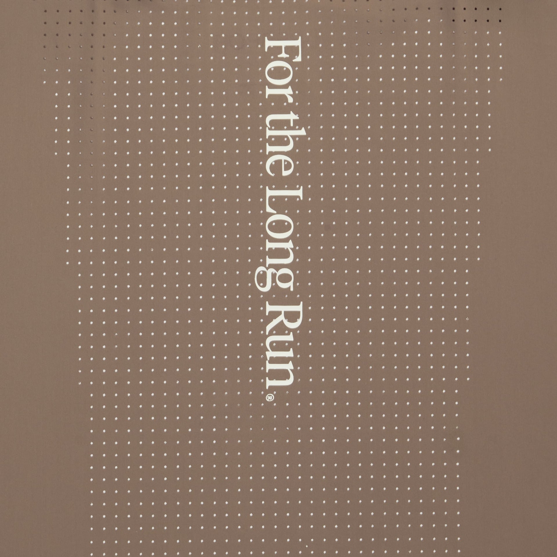 A close up shot of Puresports Performance collection fabric with the 'For the Long Run' text on a mocha fabric. 