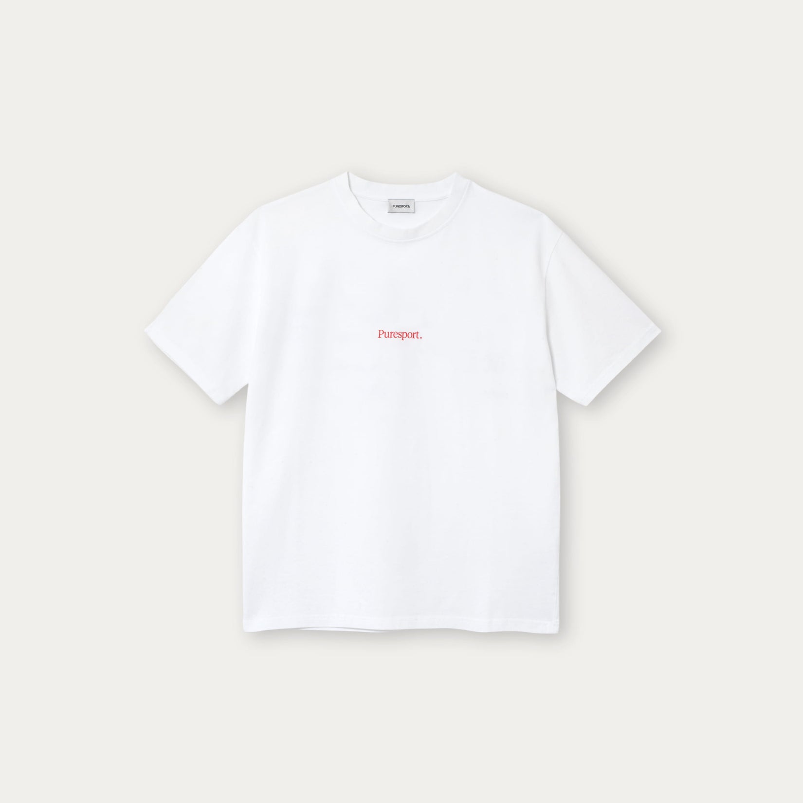 White t-shirt with red text on a light beige background