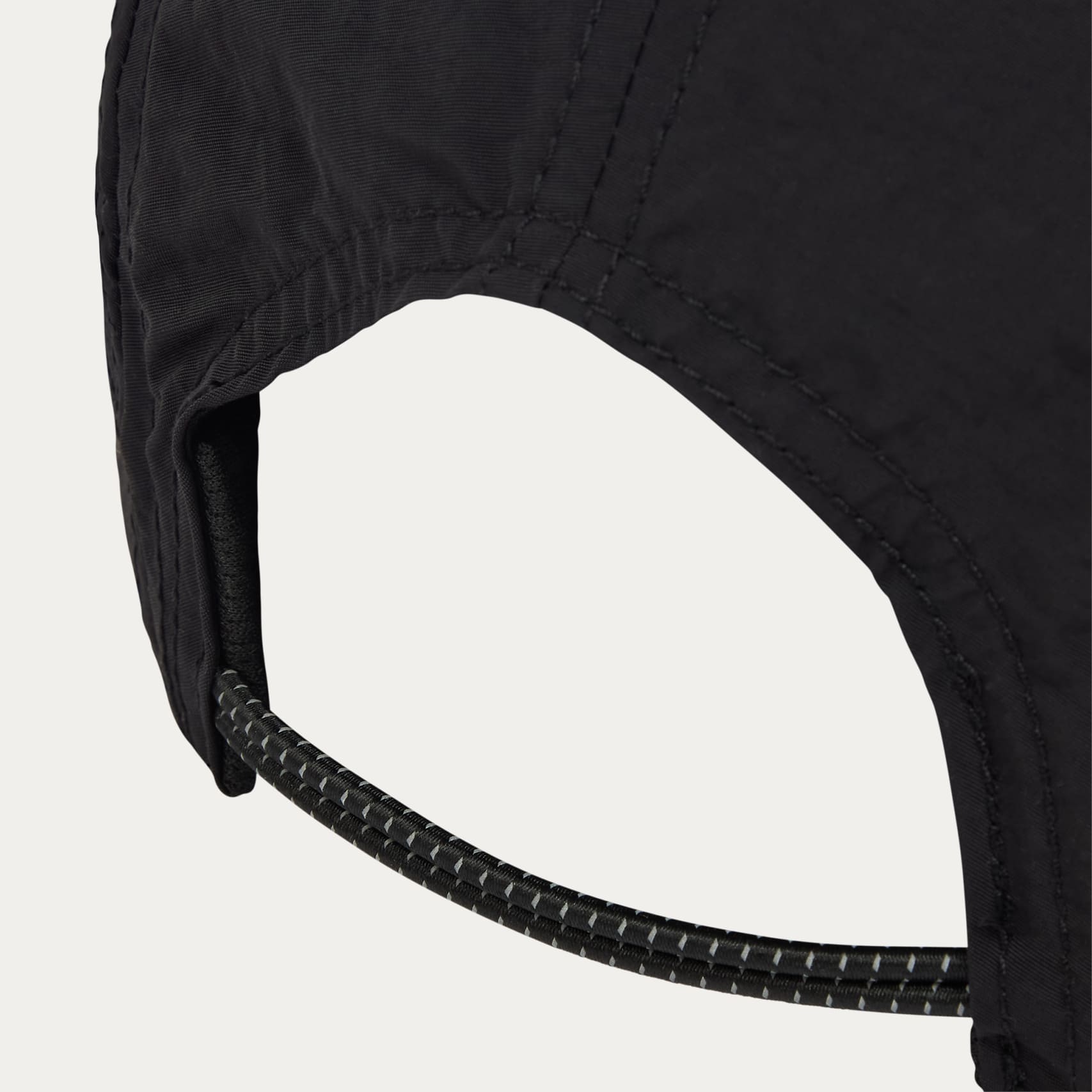Close-up of a black run cap by Puresport