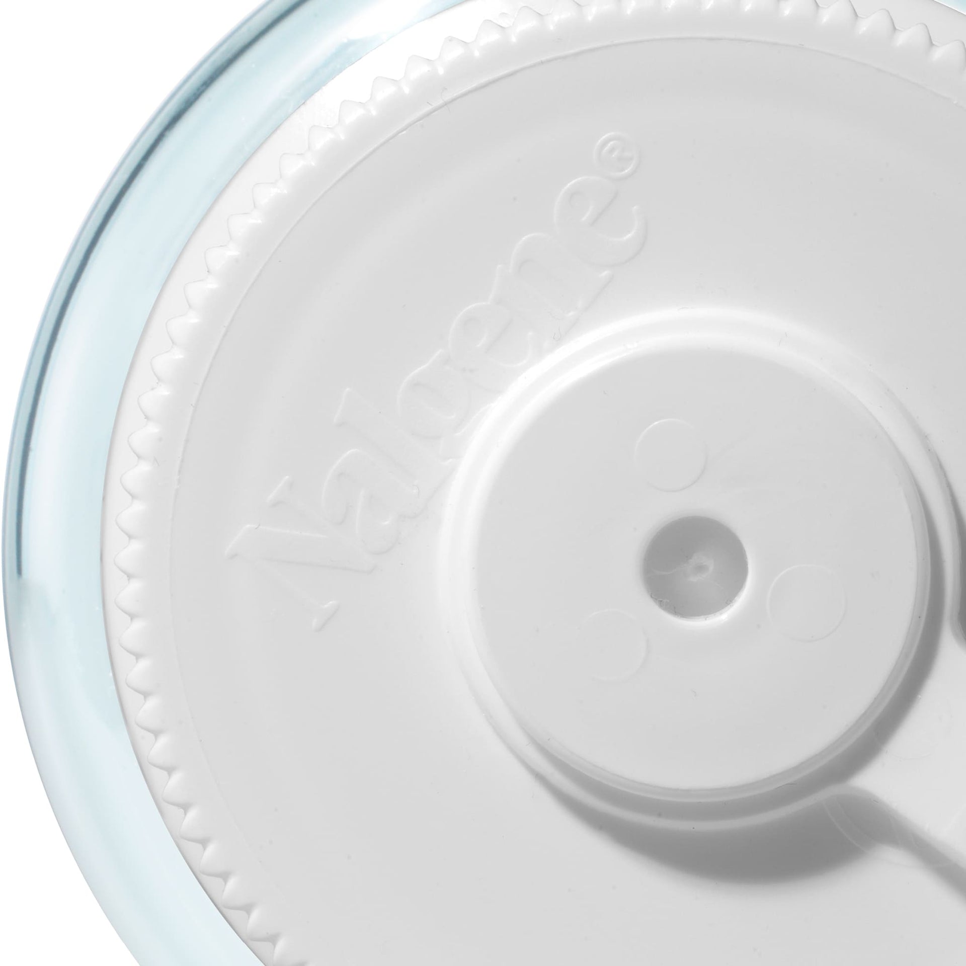 Close-up of a bottle with a white lid with a blue rim on a white background