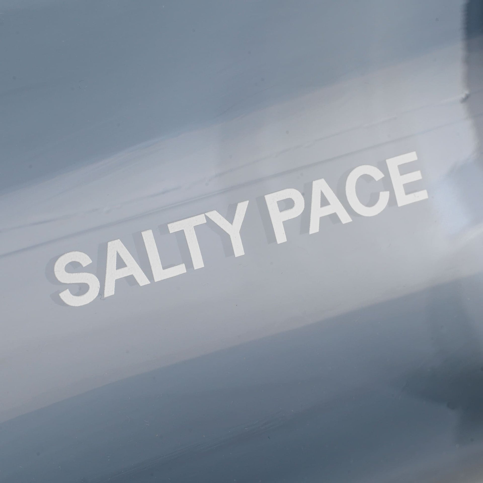 Text 'SALTY PACE' on a puresport drinking bottle