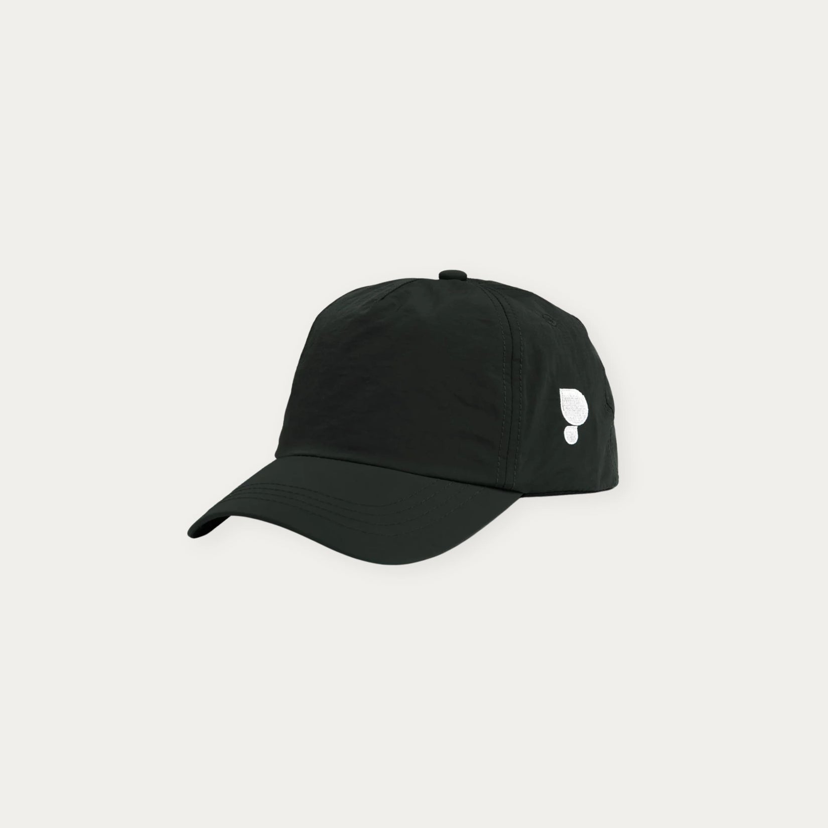 Black cap with a white logo on a light grey background