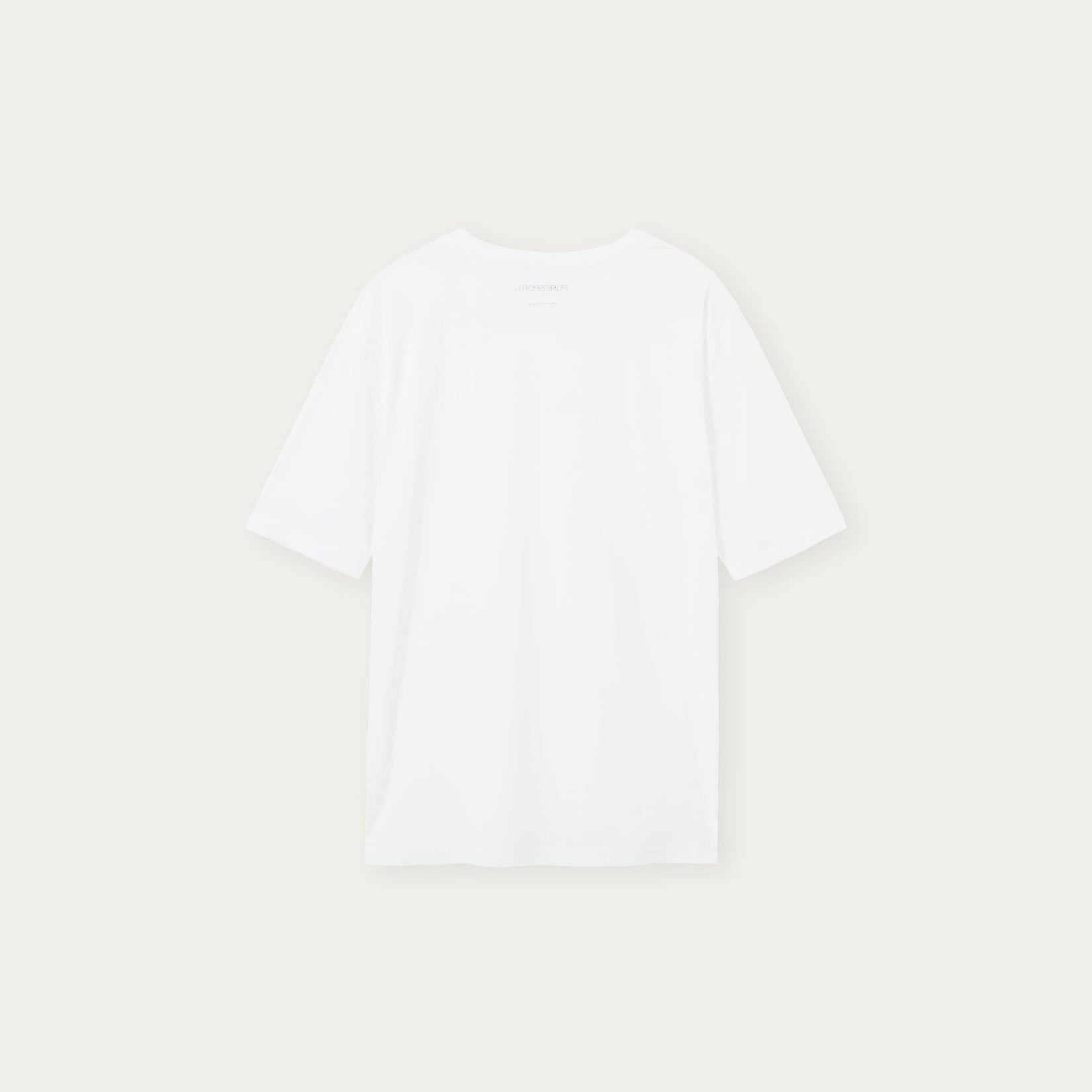 Plain white performance top on a light beige background