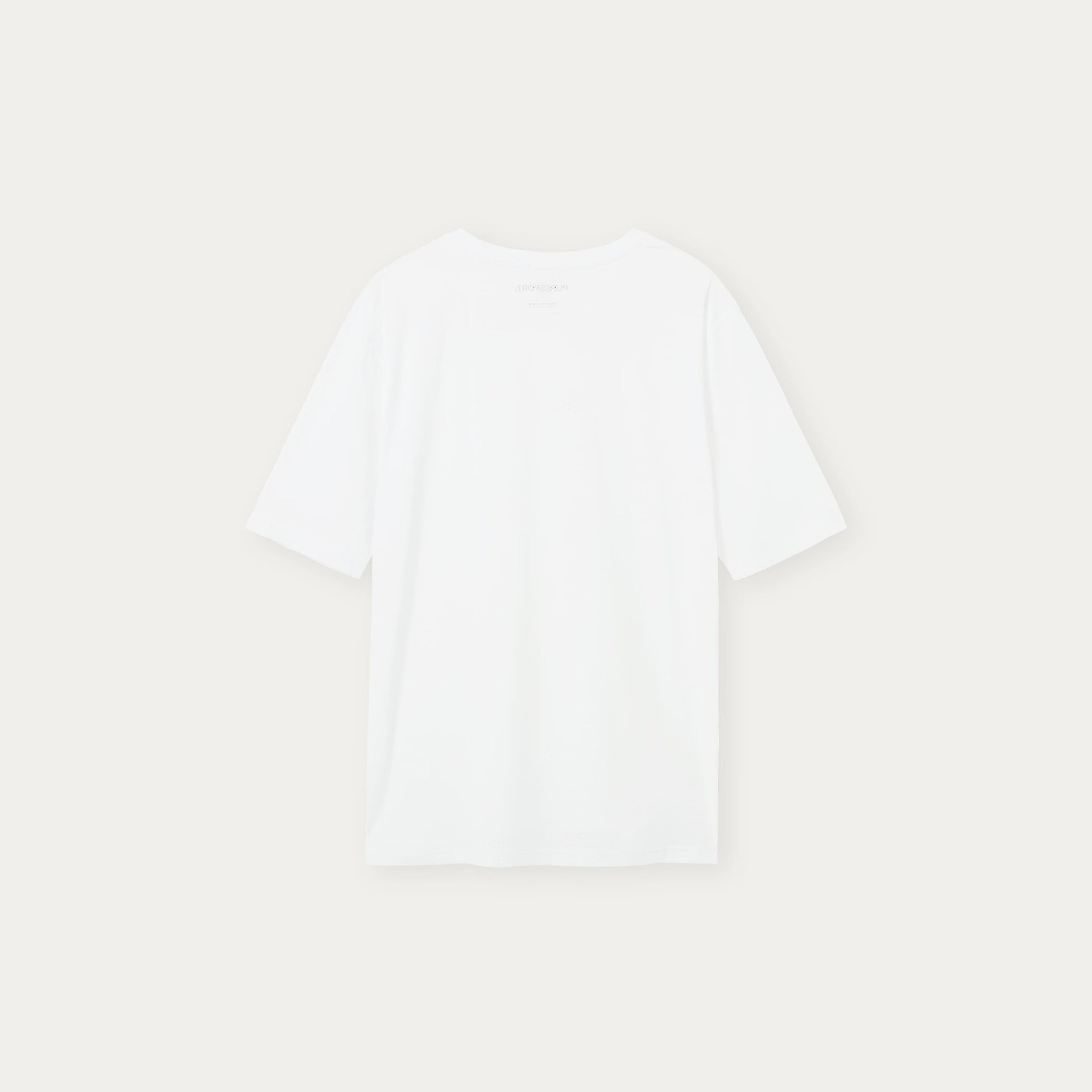 Plain white performance top on a light beige background