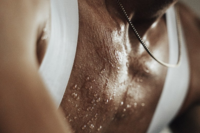 Close-up of sweat beading on an athlete's chest